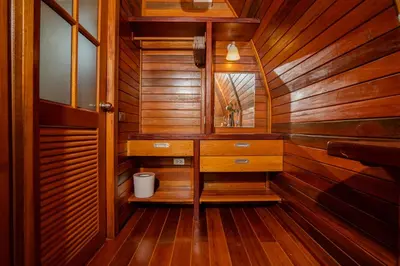 a bathroom with wooden walls and a vanity with a mirror at Tropical Chalet 2BR Villa Pasak Paradise 1 with Private Pool, Laguna 10 min drive in Bang Tao Beach