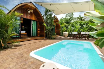a swimming pool in front of a house at Tropical Chalet 2BR Villa Pasak Paradise 1 with Private Pool, Laguna 10 min drive in Bang Tao Beach