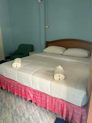 a large bed with two pillows on top of it at Adam Bungalows in Ao Nang Beach