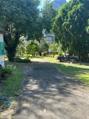 a dirt road in a park with trees at Adam Bungalows in Ao Nang Beach