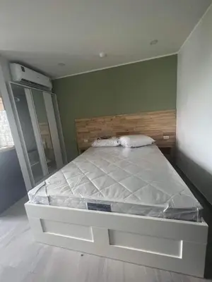 a large bed in a room with at The Tower Condo Phase3 in Ban Klang
