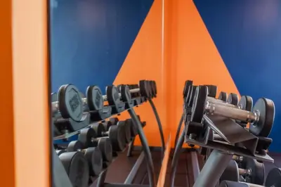a row of exercise equipment in a gym at The Tower Condo Phase3 in Ban Klang
