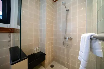 a bathroom with a shower with a glass door at Angsana Villas Laguna-3 Bedroom Pool Villa in Phuket Town