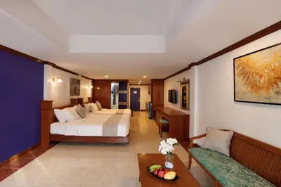 a hotel room with a bed and a couch at Aspira Resort Klong Muang Krabi in Klong Muang Beach
