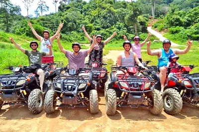 a group of people riding atvs on a dirt road at Intimate Oasis, 2 bedrooms Pool in Kata Beach