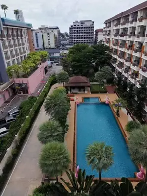an overhead view of a large swimming pool in a city at Quiet Patong Apartment near Night Life & Good Food in Patong Beach