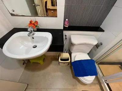 a bathroom with a toilet and a sink at Quiet Patong Apartment near Night Life & Good Food in Patong Beach