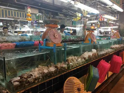 a market with three clocks on a display at Quiet Patong Apartment near Night Life & Good Food in Patong Beach