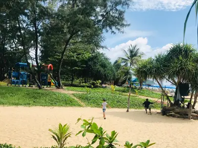 two children playing on the beach at a park at Апартаменты с видом на море на Карон Бич А 409 in Karon Beach