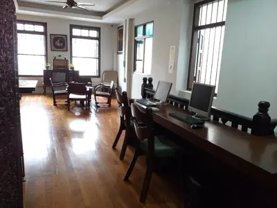 a room with a desk with two computers on it at Phuket Sunny Hostel in Phuket Town