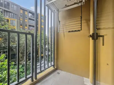a balcony with a view of a building at The Base - New Studio Great location, shared Pool in Ban Rangeng