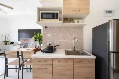 a kitchen with a sink and a counter top at 1 bedroom apartment in Nai Harn in Ban Saiyuan (1)