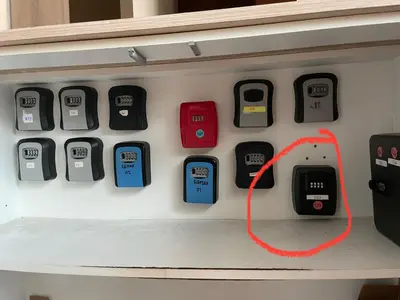 a row of cell phones on a shelf at OCEANA HOME Phuket Kamala in Kamala Beach
