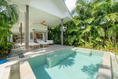 a swimming pool in the backyard of a house at Contemporary Eden - Villa Jeladore, 5BR, Garden & Pool, near Laguna in Bang Tao Beach