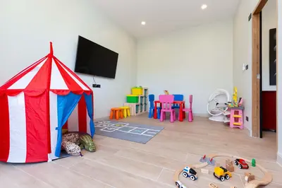 a room with a tent and toys in it at Brand-new 8BR Private Pool Villa Mystic Garden in Rawai Beach