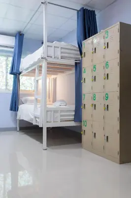 a bedroom with a bunk bed and a climbing wall at Nacha Hostel, Koh Phi Phi, Krabi. THAILAND in Phi Phi Don