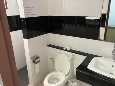 a bathroom with a toilet and a sink at Nacha Hostel, Koh Phi Phi, Krabi. THAILAND in Phi Phi Don