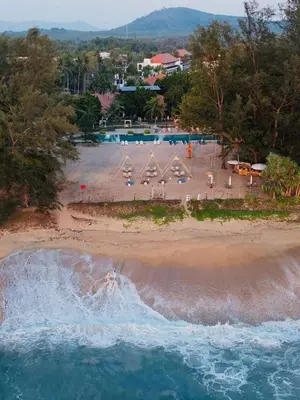 an aerial view of a beach with a pool at Estella Phuket Mai Khao Beach Resort in Mai Khao Beach