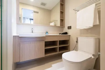 a bathroom with a white toilet and a sink at SkyPark , Bangtao , Apartment near beach 2 bedroom in Bang Tao Beach