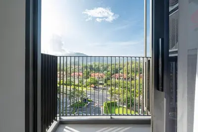 a view of a city from a balcony at SkyPark , Bangtao , Apartment near beach 2 bedroom in Bang Tao Beach