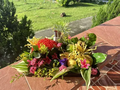 a bouquet of flowers sitting on a table at Baansuanpiyanan in Ban Bang Chak