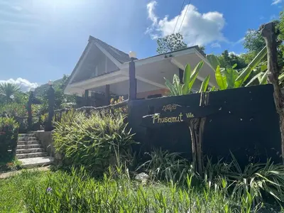 a house with a sign in front of it at Phu Samut in Ban Ba Kan Pa