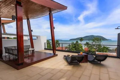 a balcony of a house with a view of the ocean at Attractive SeaView 4br Private Pool Villa in Rawai Beach