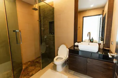 a bathroom with a toilet and a sink and a shower at Attractive SeaView 4br Private Pool Villa in Rawai Beach