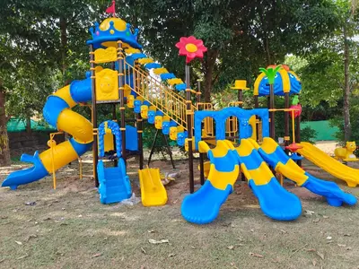 a playground with a blue and yellow slide at Kana Hotel Phuket\u666e\u5409\u5c9b\u5361\u5a1c\u9152\u5e97 in Rawai Beach