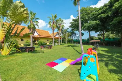 a playground in the yard of a house at Kana Hotel Phuket\u666e\u5409\u5c9b\u5361\u5a1c\u9152\u5e97 in Rawai Beach