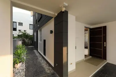 a hallway of a house with a black door at Laguna Park Grand Villa na Bang Tao in Phuket Town