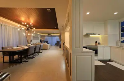 a kitchen and dining room with a table and a dining room at Laguna Park Grand Villa na Bang Tao in Phuket Town