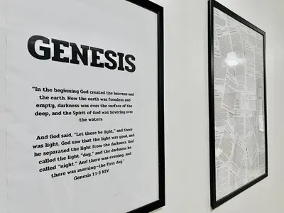 a framed picture of a sentence on a wall at Genesis Urban Phuket in Ban Lo Long