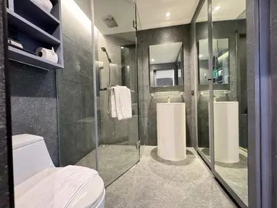a bathroom with a shower and a toilet at Citygate Peaceful Condo Kamala Beach in Kamala Beach