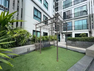 a playground in front of a building at Zcape 4U in Ban Thalat Choeng Thale