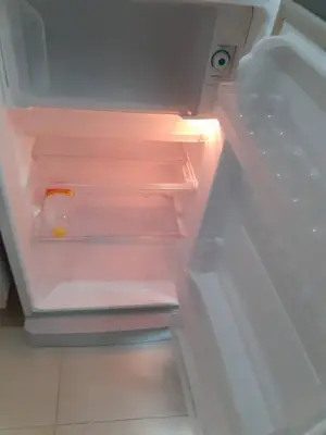 an open refrigerator with its door open and itsartmentsternessternessternessoleranceangering at Zcape 4U in Ban Thalat Choeng Thale