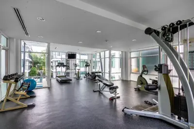 a gym with several treadmills and machines in it at \u3010\u8d85\u503c\u30112\u5367\u5ba4\u522b\u5885\u3010\u5bbd\u655e\u8212\u9002\u301113\u7c73\u957f\u79c1\u5bb6\u6cf3\u6c60\uff0c\u914d\u5957\u9f50\u5168\u51fa\u884c\u65b9\u4fbf\uff0c\u6b65\u884c700\u7c73\u5230kamala\u6d77\u6ee9 V03 in Kamala Beach