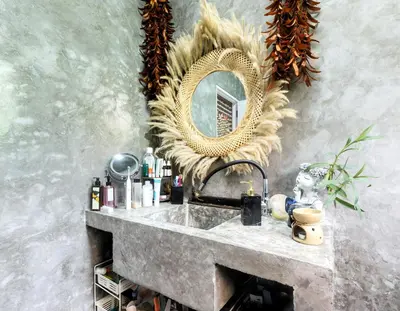 a bathroom with a sink and a mirror on the wall at Beachfront bungalow south of Phuket in Phuket Town