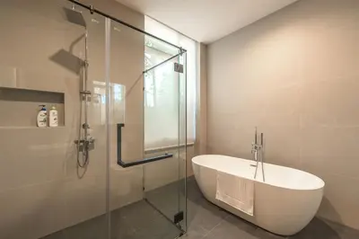 a bathroom with a sink and a glass shower at New 3BR Pool Villa Long One A5 with Chalong Bay view in Chalong