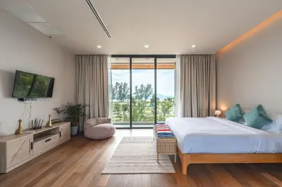 a bedroom with a large bed and a large window at New 3BR Pool Villa Long One A5 with Chalong Bay view in Chalong