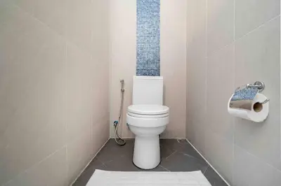 a bathroom with a toilet and a roll of toilet paper at Modern Villa , 2-bedroom, Rawai in Ban Saiyuan (1)