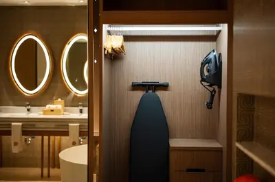 a bathroom with a sink and a toilet and a mirror at ANGSANA Oceanview Apartments with a privat pool in Laguna area in Bang Tao Beach