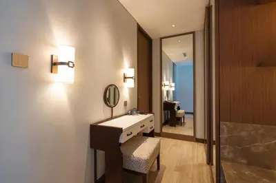 a bathroom with a sink and a mirror at ANGSANA Oceanview Apartments with a privat pool in Laguna area in Bang Tao Beach