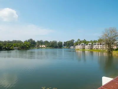 a view of a river with houses and condos at ANGSANA Oceanview Apartments with a privat pool in Laguna area in Bang Tao Beach