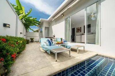 a villa with a swimming pool and a patio at Villa in Ravai , 2 bedrooms in Ban Saiyuan (1)