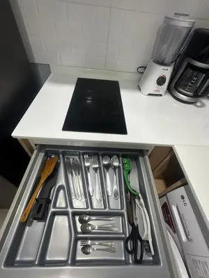 a drawer in a kitchen with utensils at Apartment Karon 62 sq in Karon Beach