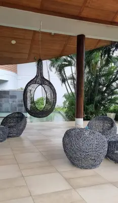 a patio with three chairs and a hanging light at Apartment Karon 62 sq in Karon Beach