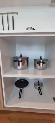 a kitchen with two pots and pans on a stove at Title V in Rawai Beach
