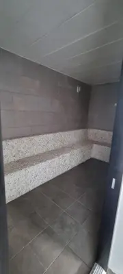 a room with a stone bench in a room at Title V in Rawai Beach
