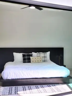 a large bed with white sheets and pillows on it at Villa Coco - Tropical Paradise with Private Pool in Thalang